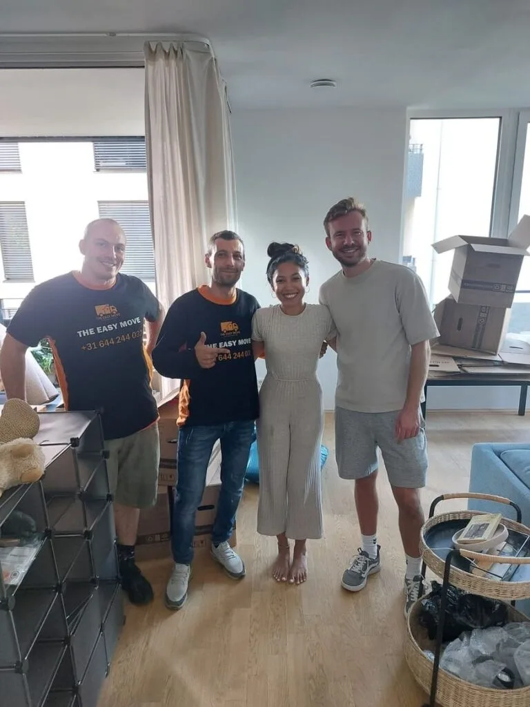 Family and movers smiling after a successful Madrid move